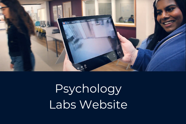 A student is holding a tablet device, observing another student using eyetracking glasses